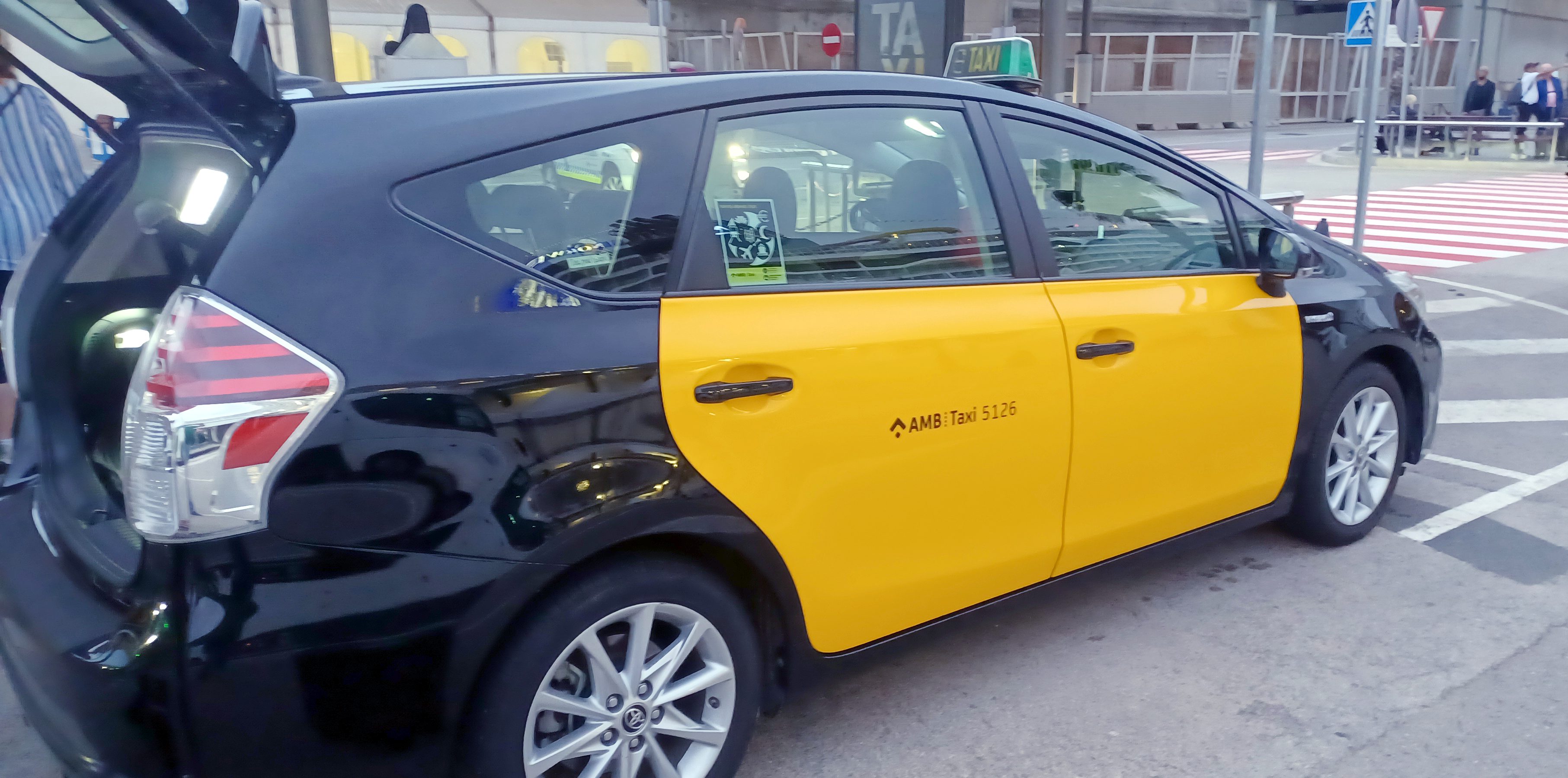 a black and yellow taxi
