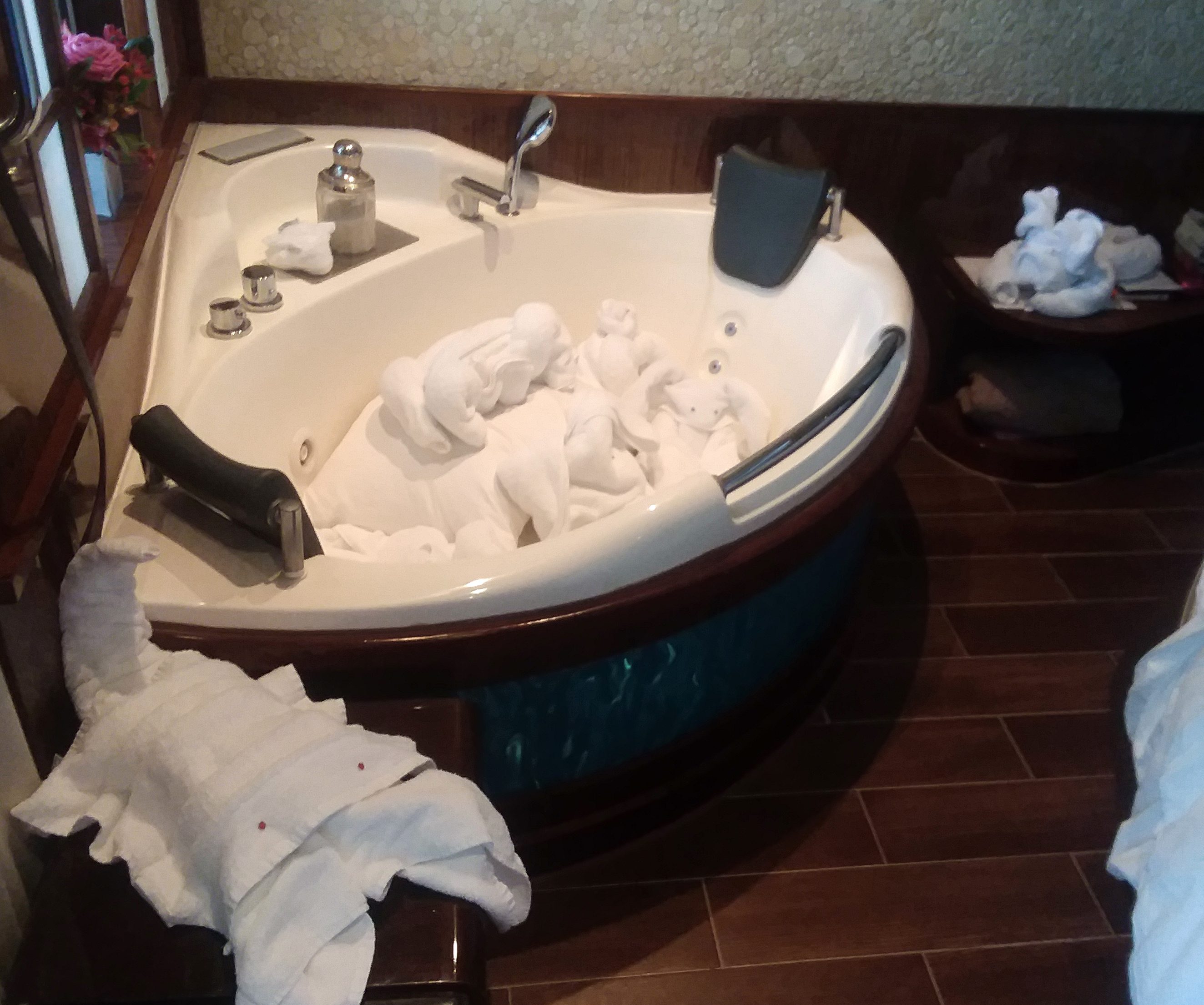 a bathtub with towels on it