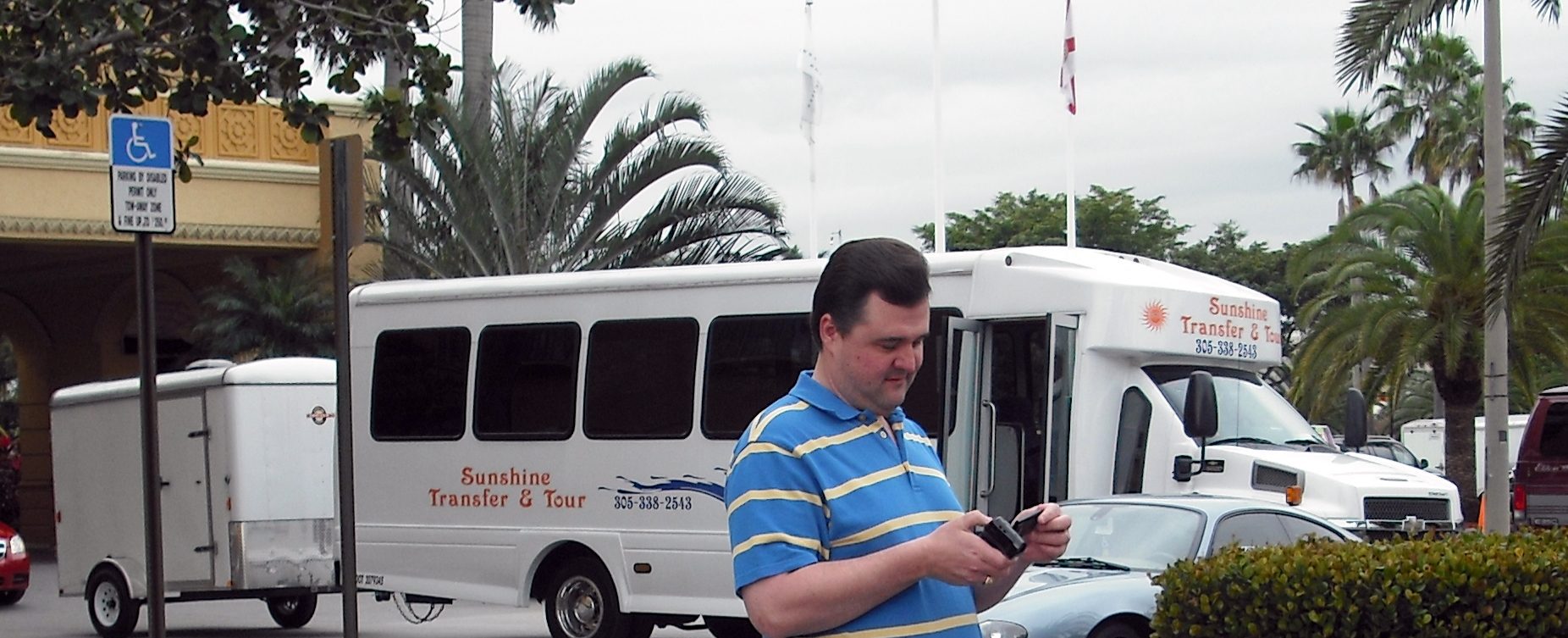 a man standing next to a bus