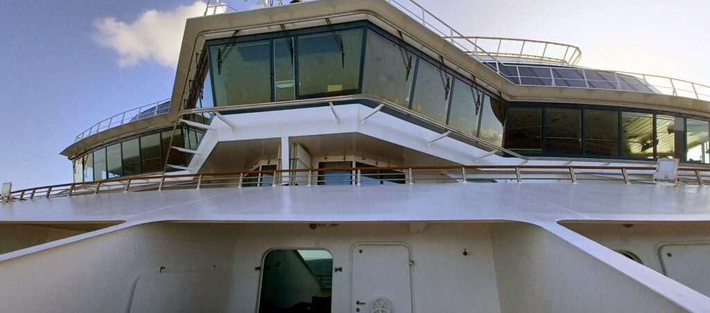 a large white ship with glass windows