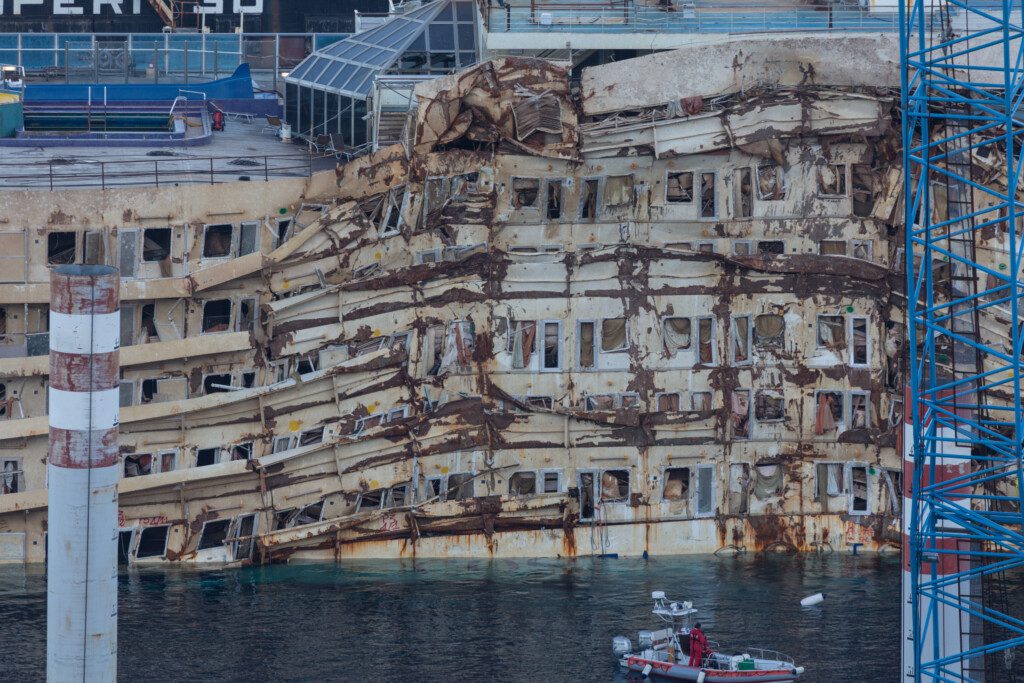 Giglio Island, Italy - October 17, 2013: The damaged area of the wreck of Costa Concordia after Parbuckling, a project that has made possible the rotation of the ship after the sinking in Giglio Island. (Photo: ©iStock.com/nicsimoncini)