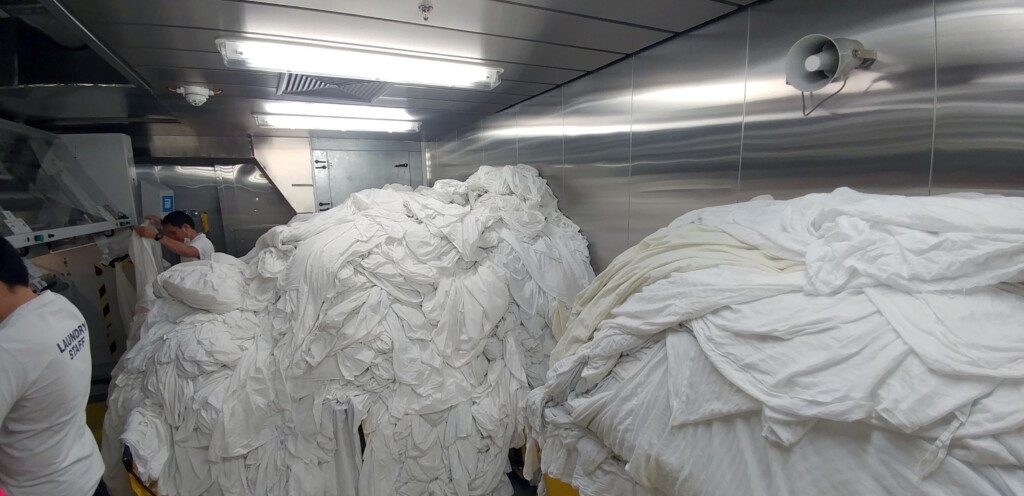 a large pile of white sheets in a room