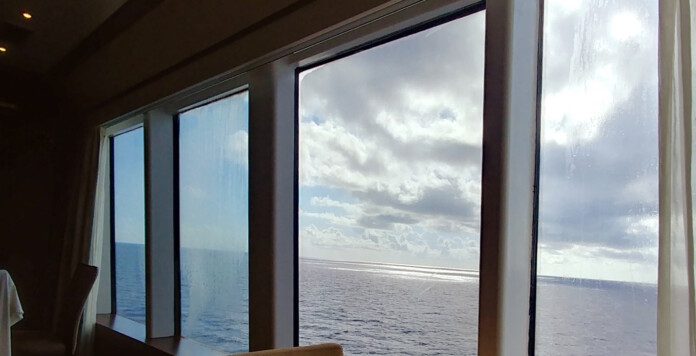 a view of the ocean from a window