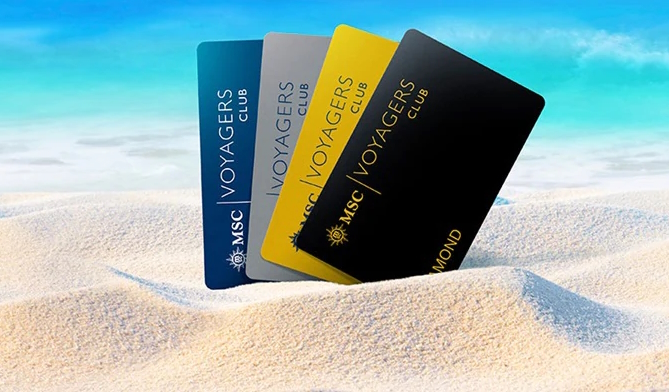 a group of credit cards in the sand