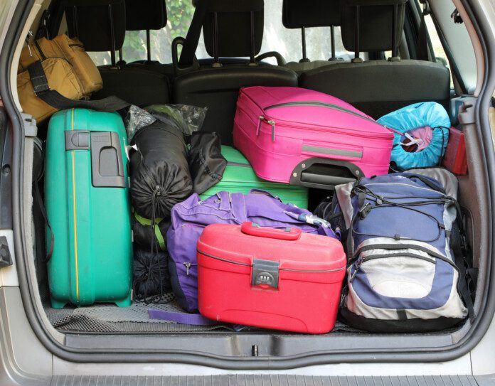 a group of luggage in the back of a car