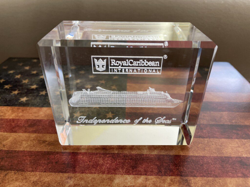 a glass block with a ship engraved on it