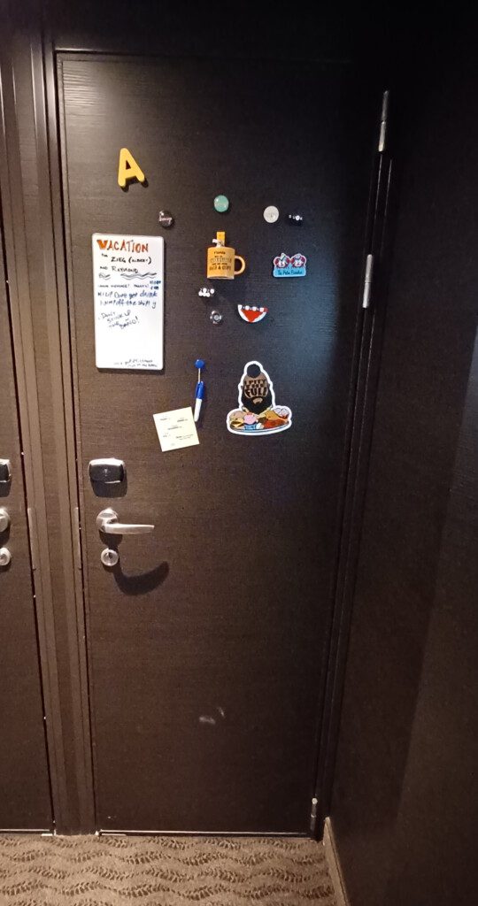 a door with magnets and a note on it