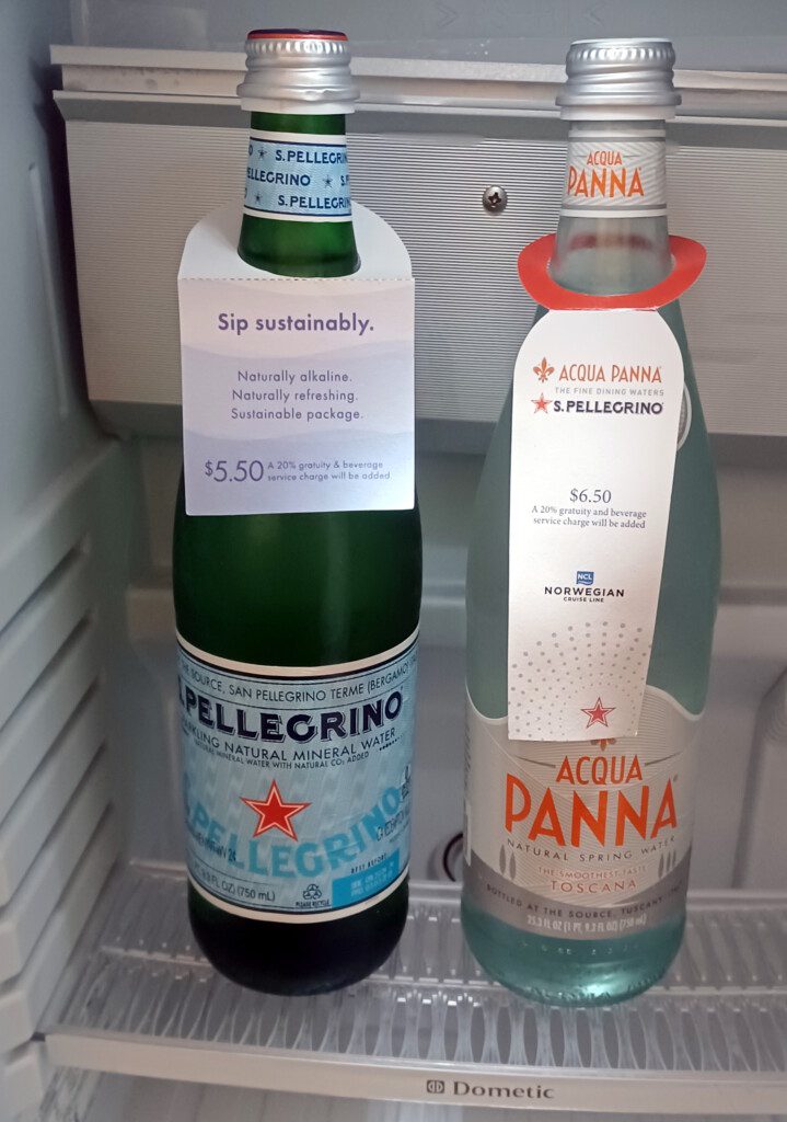 two bottles of liquid in a fridge