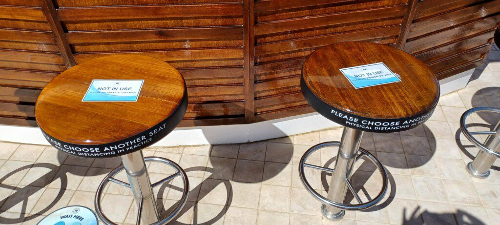 two tables with a sign on them