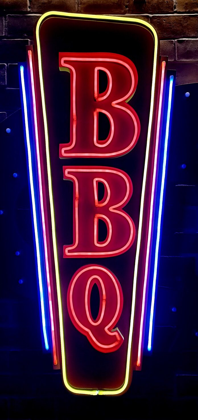 a neon sign with letters and numbers