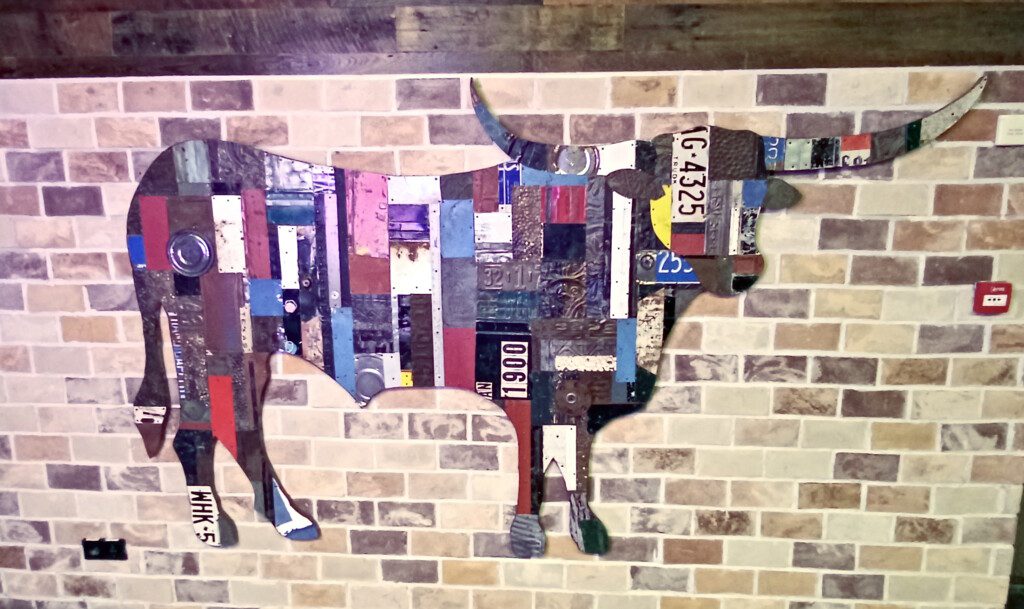 a cow made out of license plates