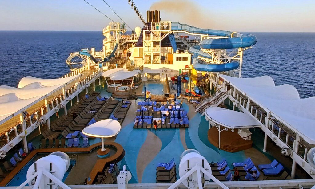 a deck of a cruise ship with a slide