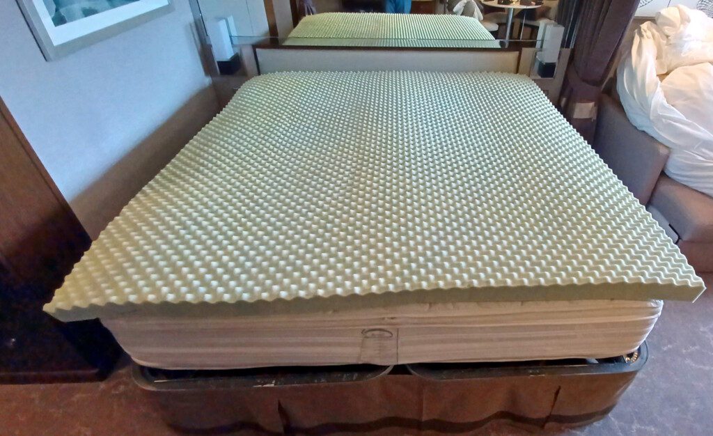 a mattress on a bed