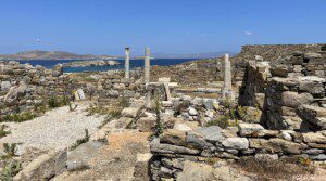 ruins of Delos with rocks and water in the background