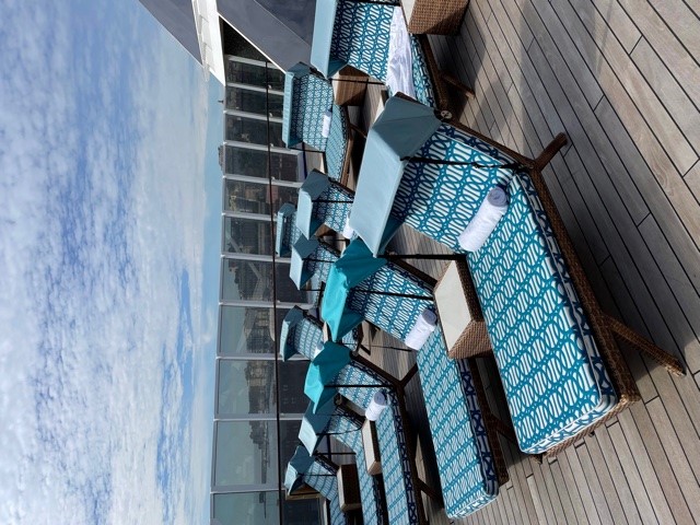 a group of lounge chairs on a deck