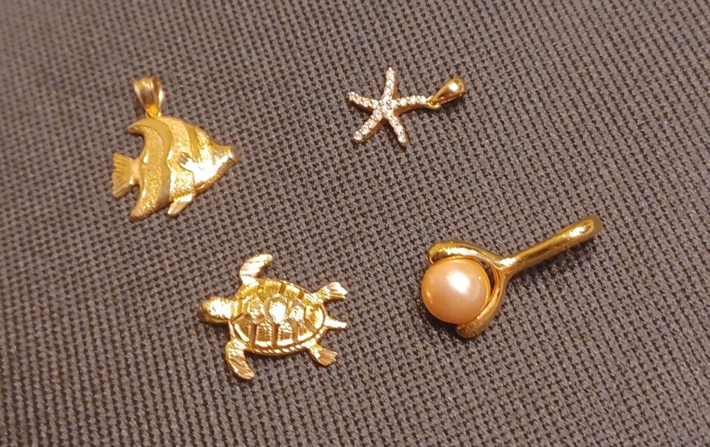 a gold jewelry on a surface
