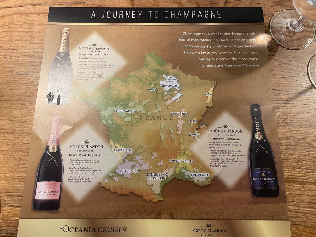 a map of champagne with a glass of wine