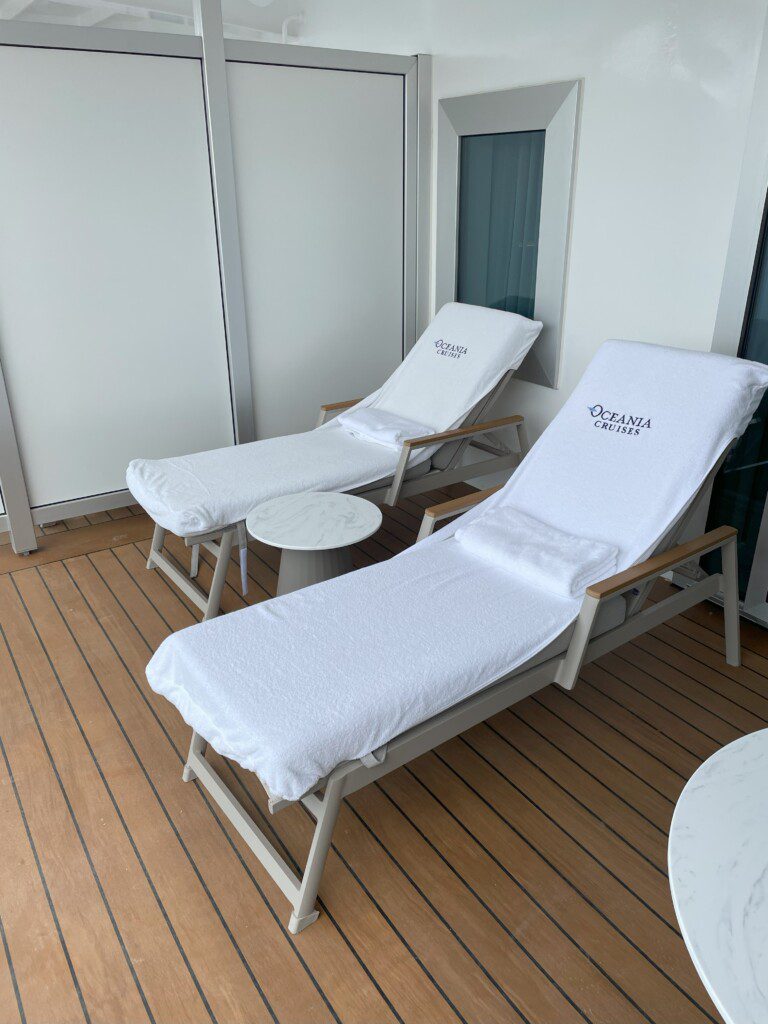 a deck chair with white covers