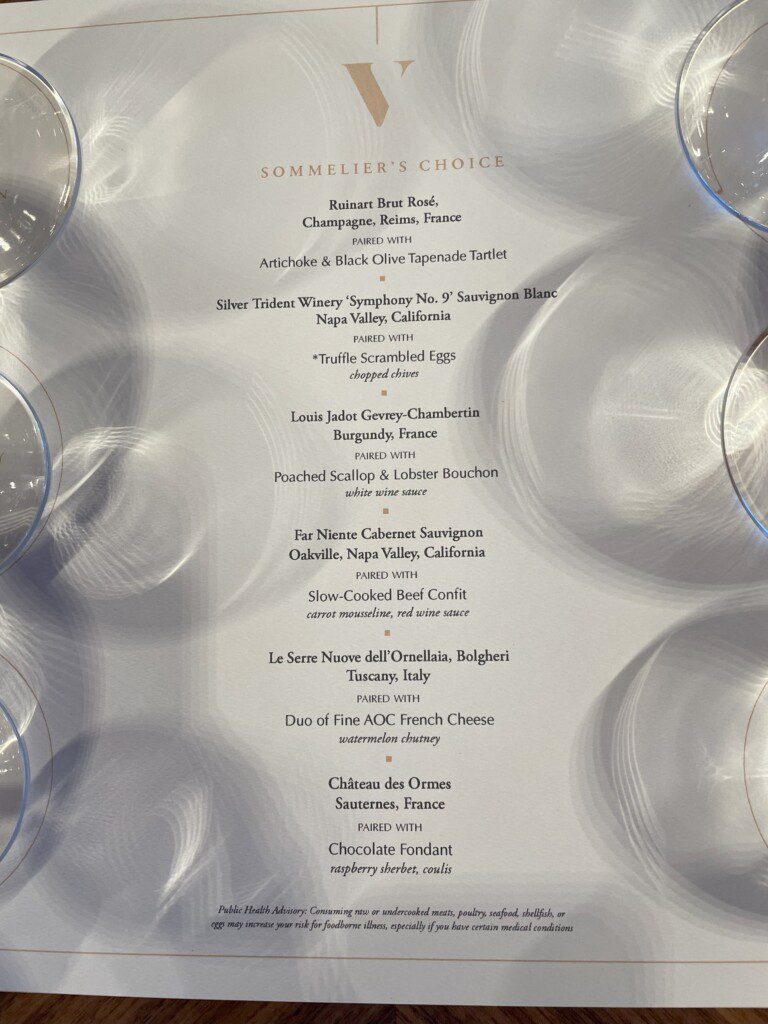 a menu with wine glasses on it