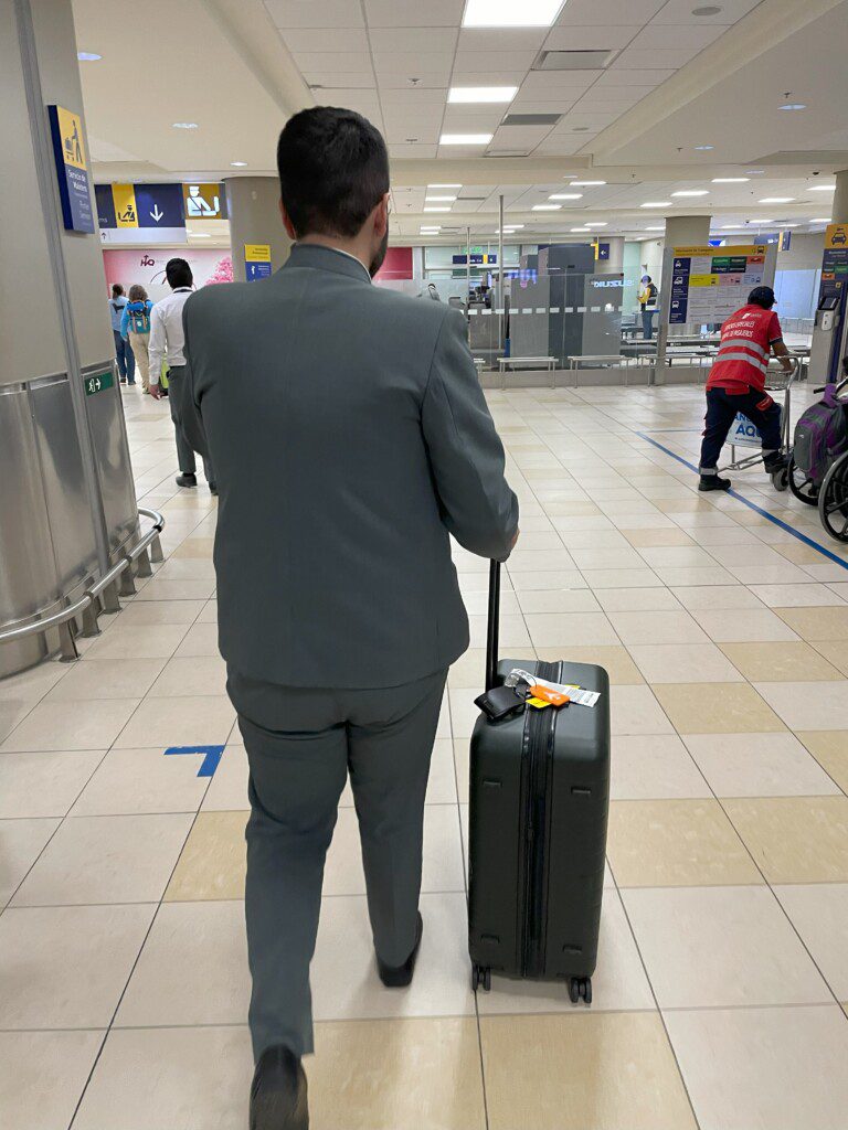 a man in a suit with a suitcase