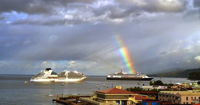 a rainbow over a cruise ship