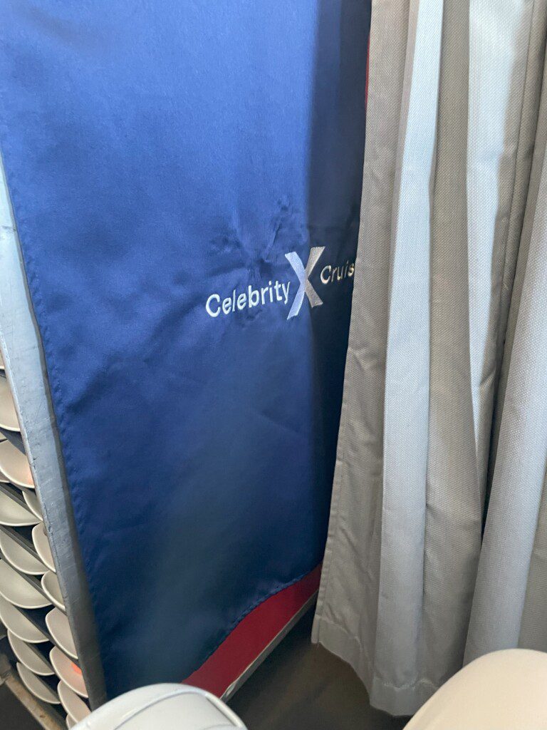 a blue towel next to a curtain