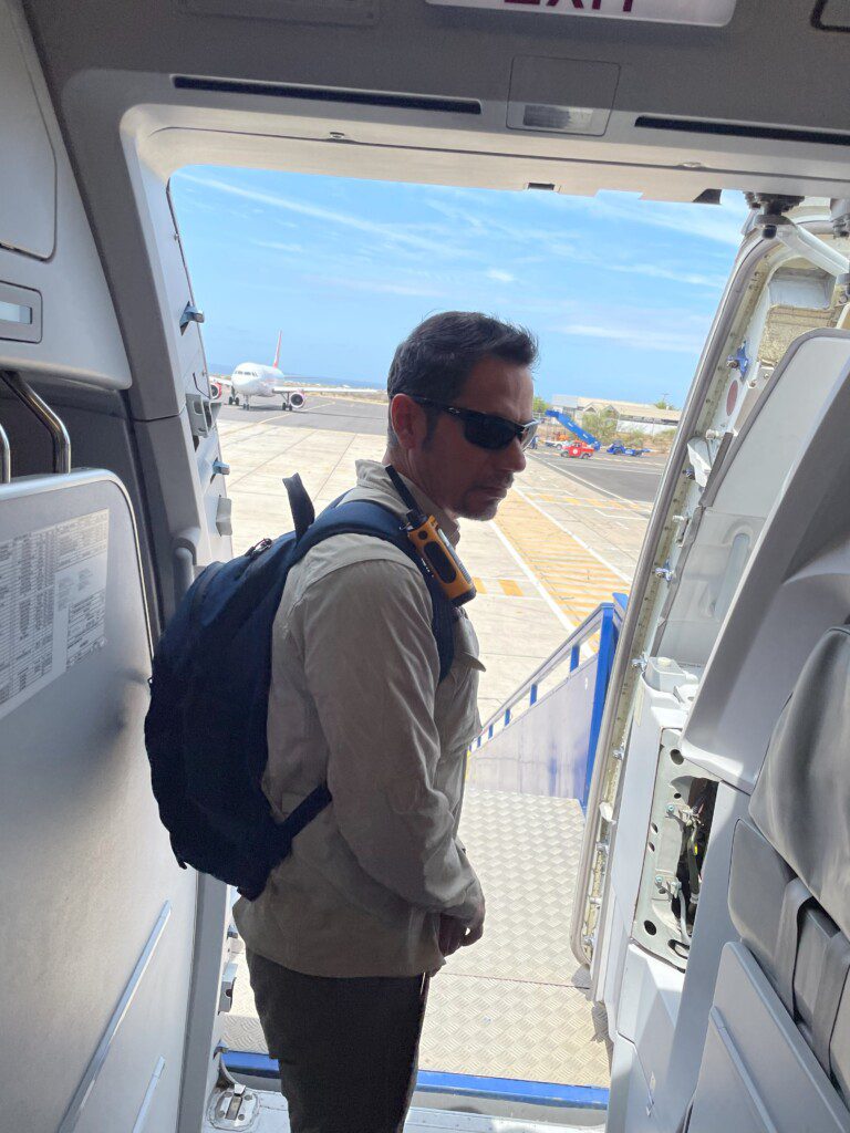 a man walking out of an airplane