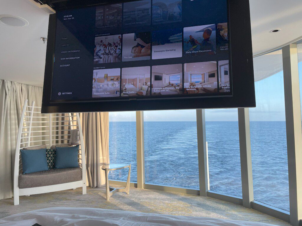 a large screen with a large window overlooking the ocean