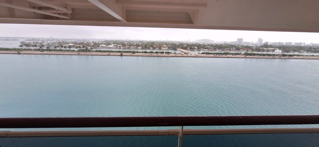 a view of a body of water from a deck of a cruise ship