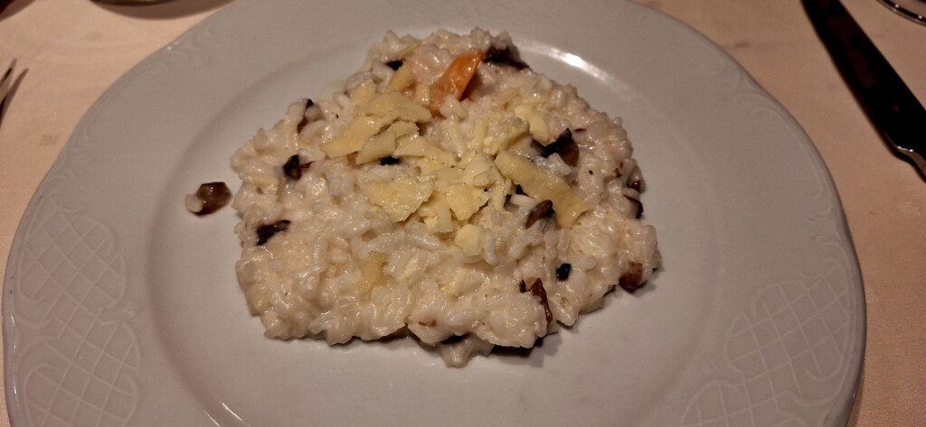 a plate of rice with cheese