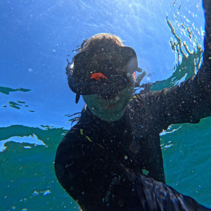 a person in a scuba mask underwater