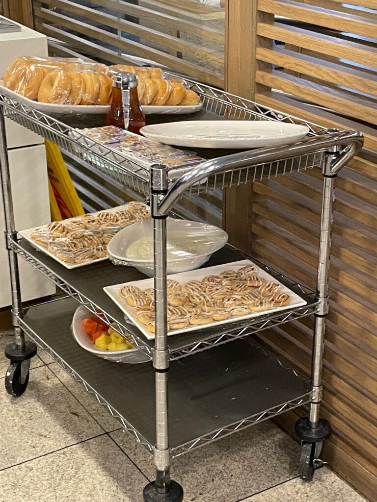 a tray of food on a metal shelf