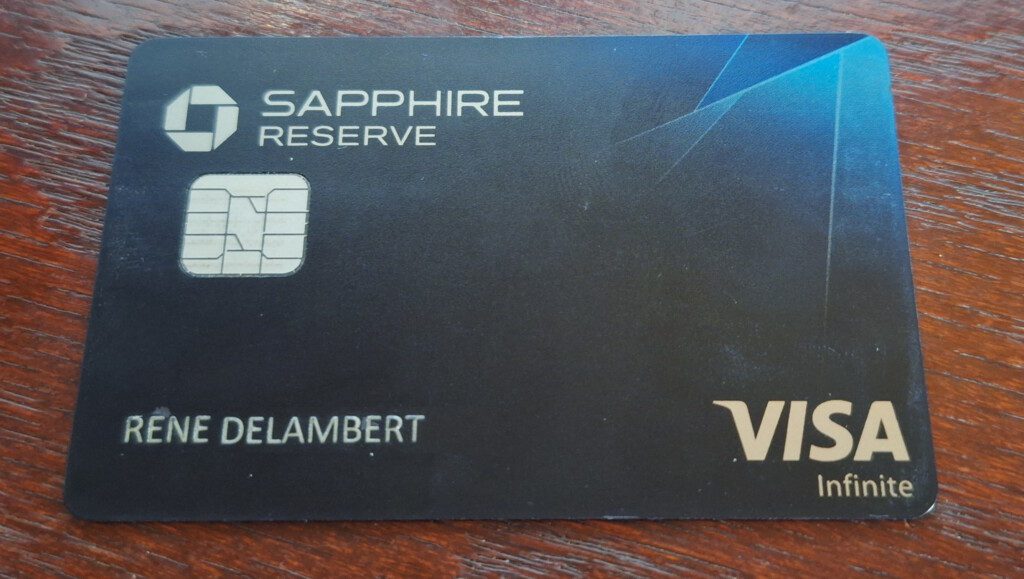 a black card with a blue and silver design
