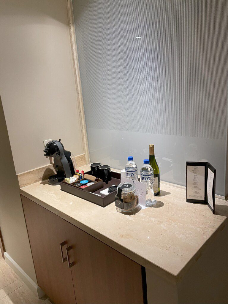 a counter with a few bottles of liquid and a picture on it