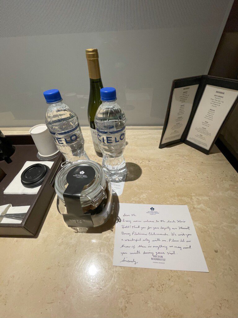 a table with a menu and bottles of water