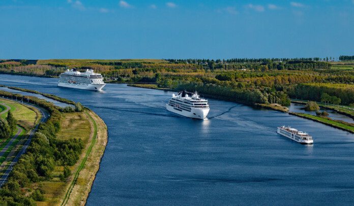 a group of cruise ships on a river