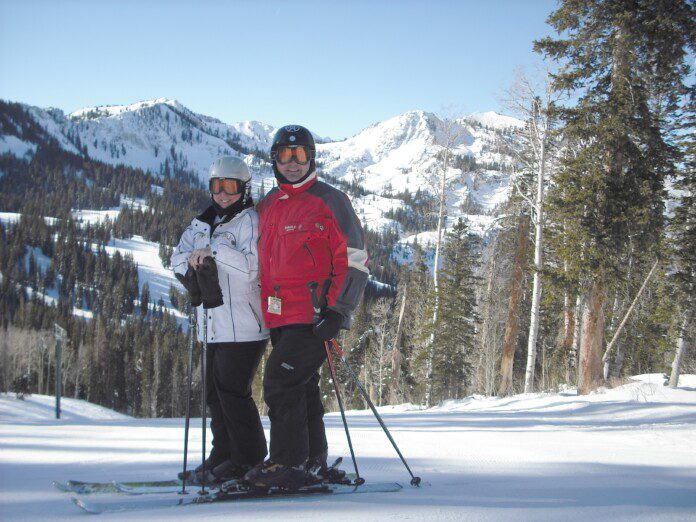 a man and woman on skis