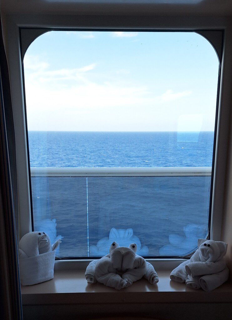 a window with a view of the ocean
