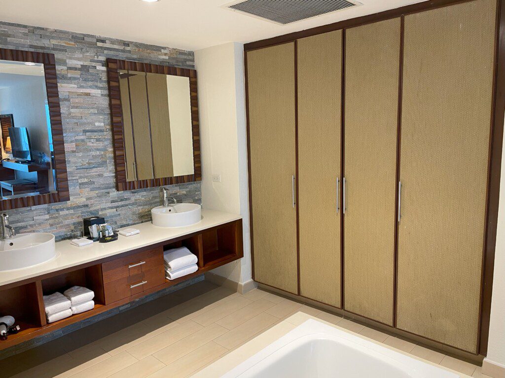 a bathroom with a tub and cabinets