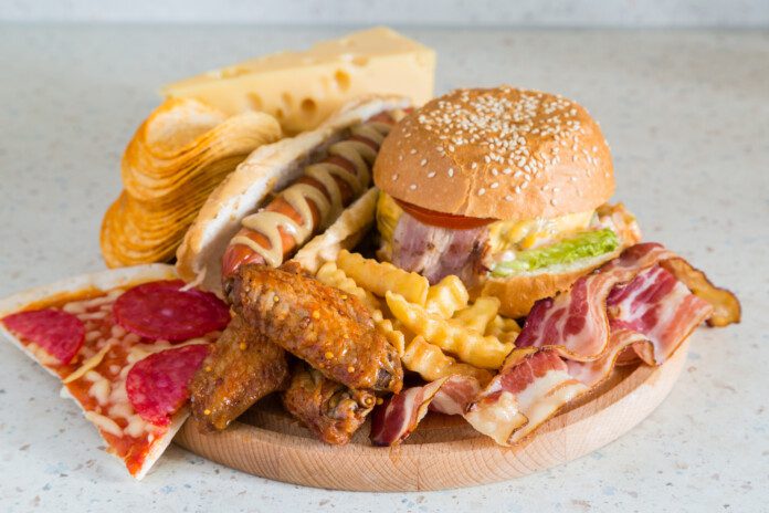 Burgers, fries, wings, bacon, and pizza.